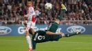 Real Madrid player Karim Benzema scores with a bicycle kick against Ajax