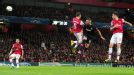 Olympiakos' Kostas Mitroglou scores the equaliser against Arsenal