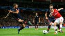 Arsenal's Lukas Podolski, right, scores his sides second goal
