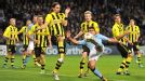 Neven Subotic moves to block Sergio Aguero's shot as Manchester City win a late penalty