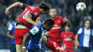 Paris Saint Germain's Zlatan Ibrahimovic heads the ball past Porto's Alex Sandro