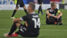 Viktoria Plzen's Radim Reznik and David Limbersky show their disappointment after their late defeat to Atletico Madrid
