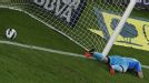 Iker Casillas reacts after Lionel Messi scores Barca's second goal