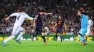 Lionel Messi of Barcelona scores his team's first goal past Iker Casillas