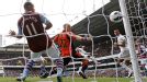 Tottenham Hotspur's English Steven Caulker scores past Aston Villa's US goalkeeper Brad Guzan