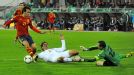 Spain's David Silva vies with Belarus' Aleksandr Martynovich and goalkeeper Segey Veremenko 