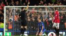 Referee Mark Clattenburg gives Fernando Torres his marching orders