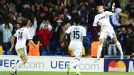 Mesut Ozil leaps in the air after scoring the goal which ensured Real Madrid avoided a home defeat at the hands of Borussia Dortmund
