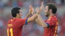 Goalscorer Pedro celebrates one of his goals against Panama with Juan Mata