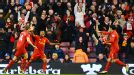 Liverpool celebrate after Luis Suarez scored thir opening goal against Wigan