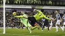 Petr Cech acrobatically tries to keep the ball in play when up for a corner at West Brom