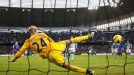 Carlos Tevez beats Ben Howard from the spot to bring Man City level against Everton