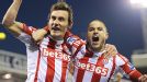 Dean Whitehead celebrates with Michael Kightly after scoring the winner at Stoke