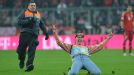 A fan gets a little over-exciting during the crucial Dortmund versus Bayern Bundesliga clash