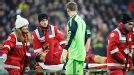 Manuel Neuer checks on Holger Badstuber as he is carried off injured against Dortmund