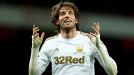 Double-goal hero Michu celebrates against Arsenal