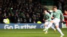 Kris Commons blasts home from the penalty spot to put Celtic into the next round of the Champions League