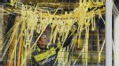 Dortmund goalkeeper Roman Weidenfeller removes paper streamers from his goal during the game against Wolfsburg
