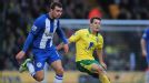 Norwich goalscorer Wes Hoolahan battles for possession with Wigan's James McArthur