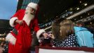 Santa hands out presents to supporters at Upton Park