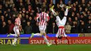 Kenwyne Jones celebrates acrobatically after putting Stoke into the lead against Liverpool