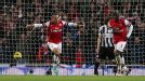 Theo Walcott celebrates putting Arsenal into a 4-3 lead