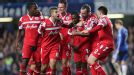 QPR players celebrate after taking the lead against Chelsea