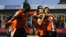 Luton celebrate after taking the lead against Wolves through Alex Lawless