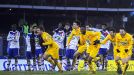 The celebrations begin for Epinal as Lyon's players can only look on in horror