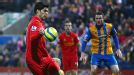 Luis Suarez controls the ball with his hand before scoring what proved to be Liverpool's winner at Mansfield