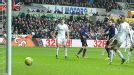 Lukas Podolski's swivel, turn and shot brought Arsenal level at Swansea
