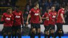 Manchester United celebrate taking the lead at Tottenham through Robin van Persie