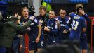 Matt Smith celebrates with his team-mates after putting Oldham into a 2-1 lead