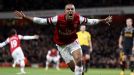 Theo Walcott celebrates netting the equaliser against Liverpool