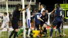Matt Smith (c) wheels away after scoring Oldham's late equaliser