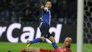 Joao Moutinho wheels away after putting Porto in front against Malaga