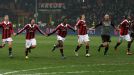 AC Milan players celebrate as a team following their 2-0 victory against Barcelona in the Champions League