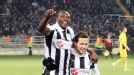 Shola Ameobi celebrates with Yohan Cabaye after scoring against Metalist Kharkiv in Ukraine