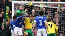 Tim Howard punches clear from Grant Holt - but the Norwich striker had the last laugh with an injury-time winner at Carrow Road.