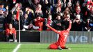 Luis Suarez celebrates after his first time finish have Liverpool the lead at home to Spurs 