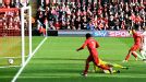 Luis Suarez beats Hugo Lloris to put Liverpool one up against Tottenham