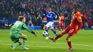 Burak Yilmaz lifts the ball over Timo Hildebrand for Galatasaray's second goal at Schalke
