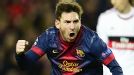 Lionel Messi celebrates after scoring his second goal against Milan