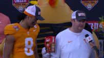 'Ched-Z' slides box of Cheez-It crackers through Josh Heupel's postgame interview