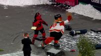 Gritty and the NJ Devil throw cakes at a fan