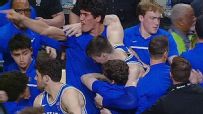 Duke's Kyle Filipowski helped off after Wake Forest fans storm the court