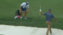 Stewart Cink picks up the eagle from the bunker