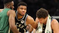 Giannis Antetokounmpo helped off court with calf injury