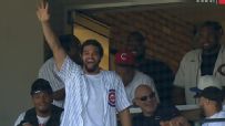 Caleb Williams waves to crowd at Cubs' game