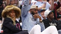 LeBron gets ovation in Cleveland while sitting courtside